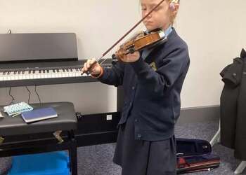 Our first strings student hard at work